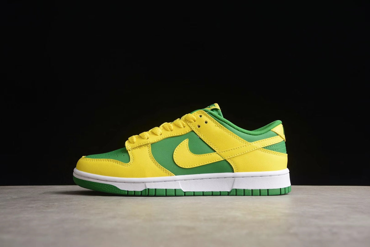 Side profile of the green and yellow sneaker showing the Swoosh, layered panels, and green outsole.