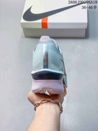 Rear view of the shoe showing the textured heel, vertical Nike detail, and sculpted heel section.