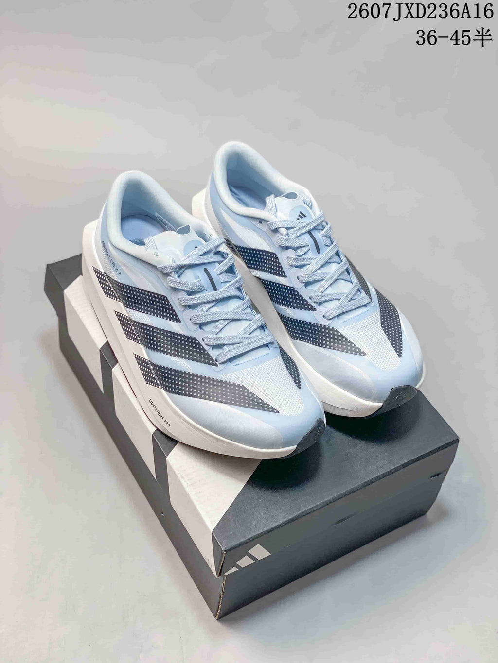 Pair of light blue, white and dark adidas Adizero Evo SL 2 running shoes displayed on a shoebox; overlay shows the listed EU size range 36–45.