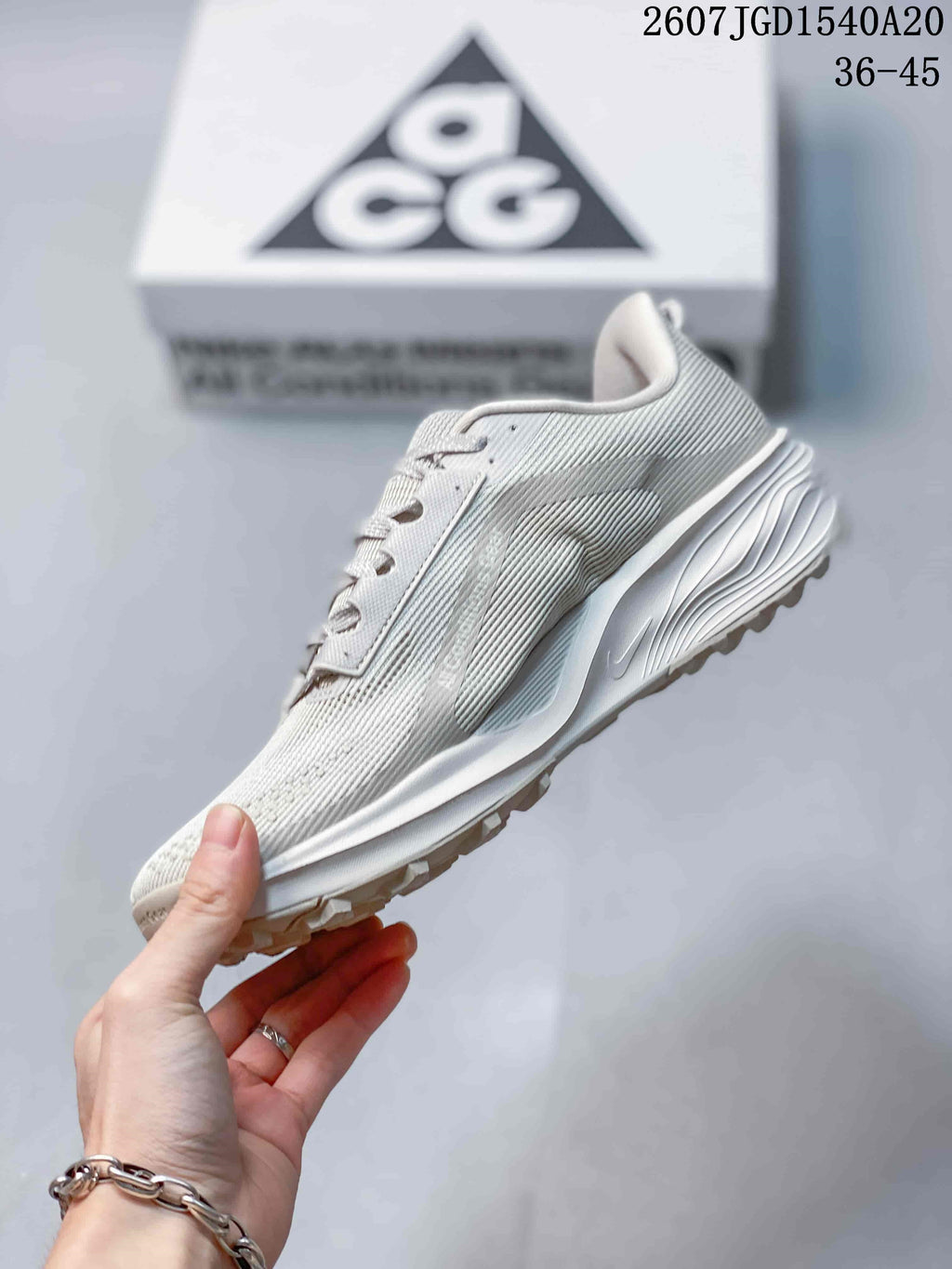 Side view highlighting the layered upper, swoosh detail, cushioned midsole, and lugged outsole.