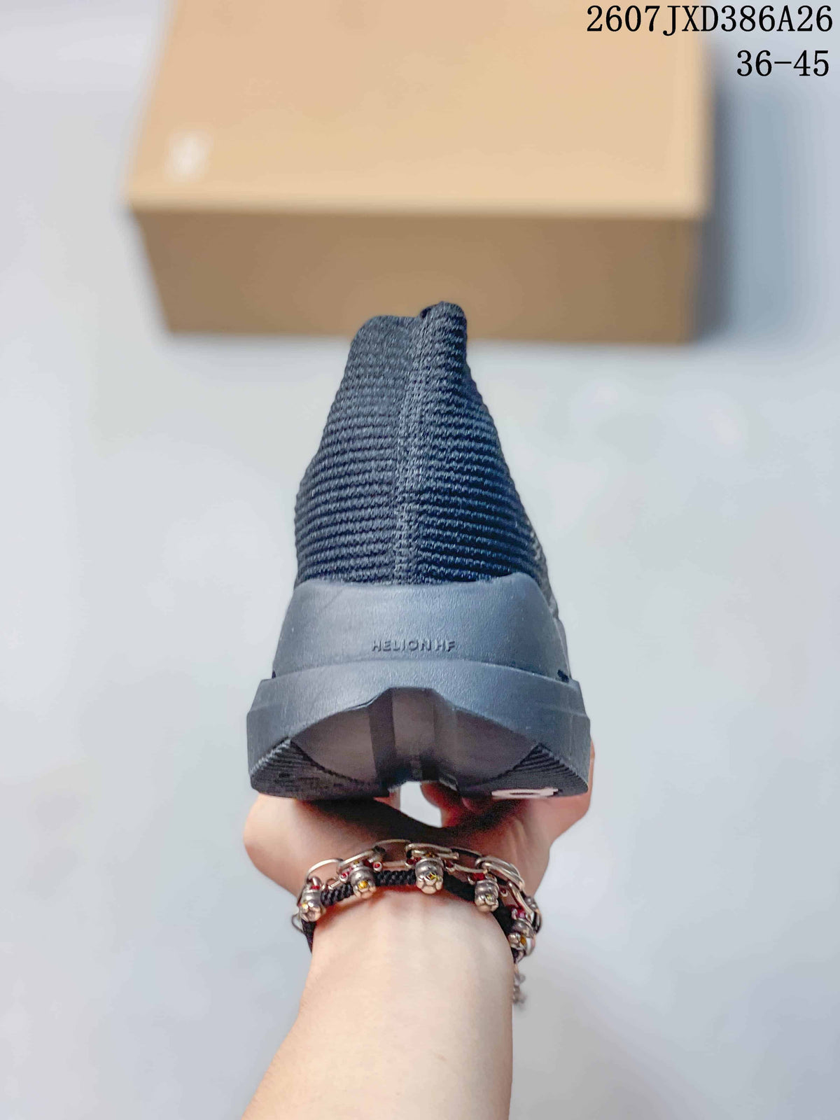 Rear view showing the knit heel, structured sole, and visible heel branding.
