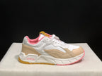 Close side view of one sneaker showing Off-White branding, beige panels, white upper sections and pink outsole accents.