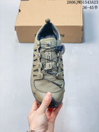 Top view of the shoe showing mesh, toggle-style lacing, and tongue branding