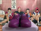 Front view of purple Nike basketball shoes with turquoise-blue tongue logos and lace-up closure.