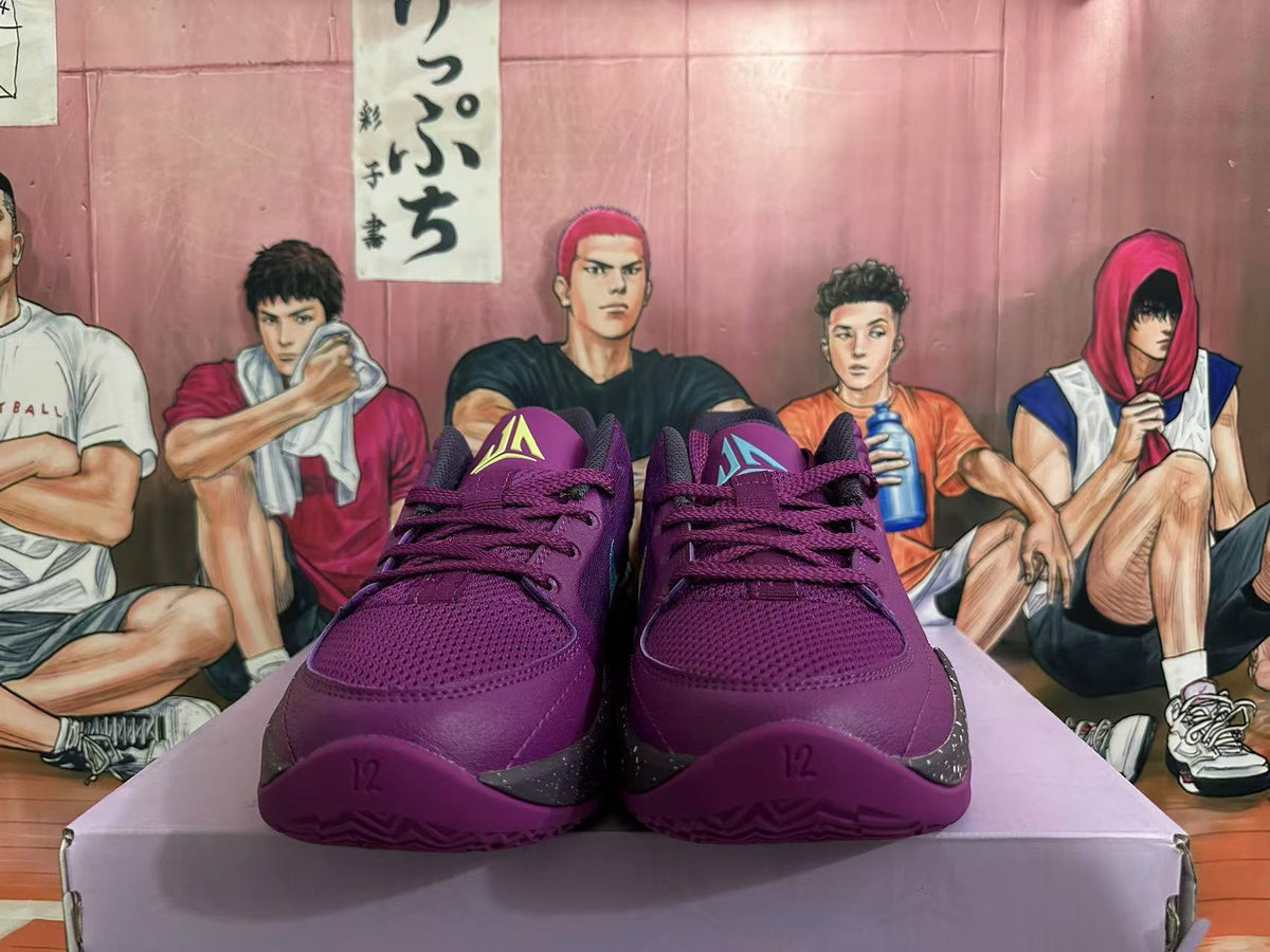 Front view of purple Nike basketball shoes with turquoise-blue tongue logos and lace-up closure.