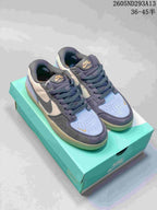 Pair of Nike SB Force 58 low-top sneakers shown from above on a turquoise shoebox, with gray, light blue and off-white panels.
