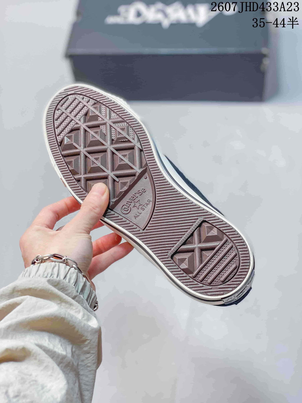 Close view of the textured rubber outsole with Converse All Star branding.