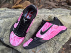 Angled view of both shoes showing patterned pink uppers
