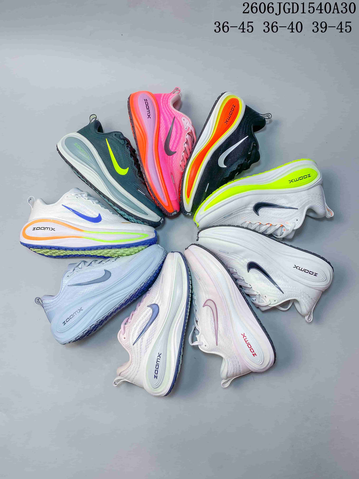 Several Nike Vomero Plus running shoes arranged in different colorways; image also shows size ranges.
