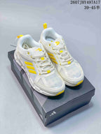 Pair of white and yellow Adidas Climacool Ventage sneakers displayed on a shoebox; the image also shows the printed range 39–45.
