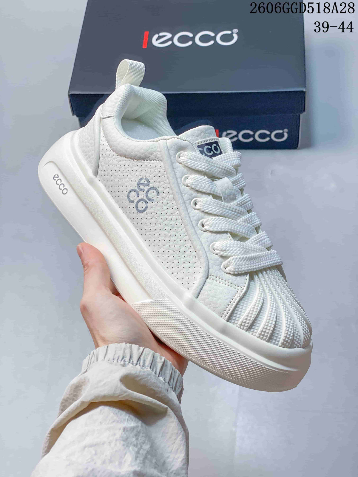 Angled view of the white sneaker with perforated side panels and ECCO branding