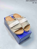 Pair of light beige Birkenstock-labeled sandals displayed on a branded shoebox; style code 2607JXD295A15 and size range 35–45 are overlaid.