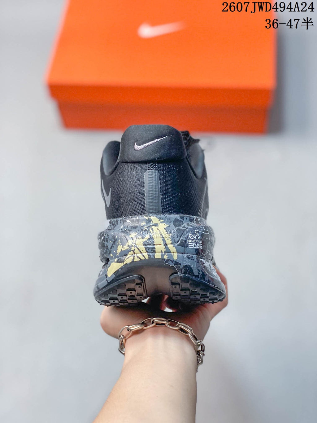 Rear view of the sneaker showing the Nike heel logo and patterned midsole detailing.