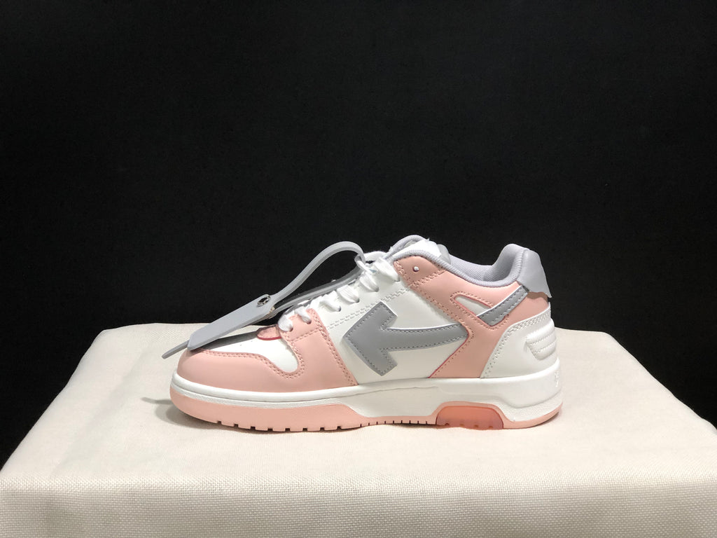 Outer side profile of one low-top sneaker showing the large contrasting side emblem and layered panels.