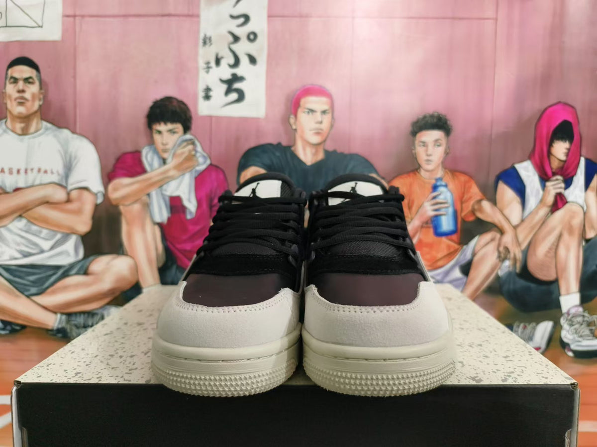 Front view of black and cream low-top sneakers with black laces