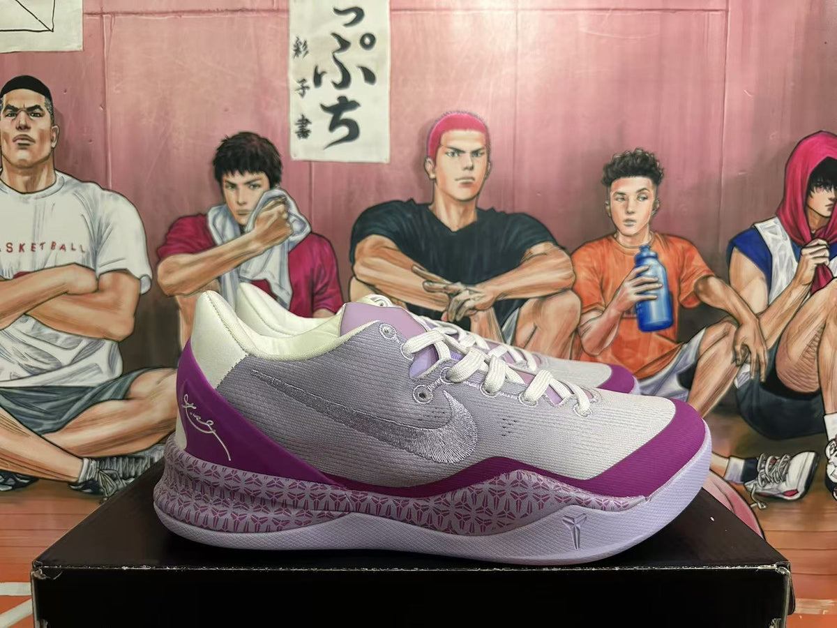 Side view of the shoes with a Nike Swoosh and patterned midsole.