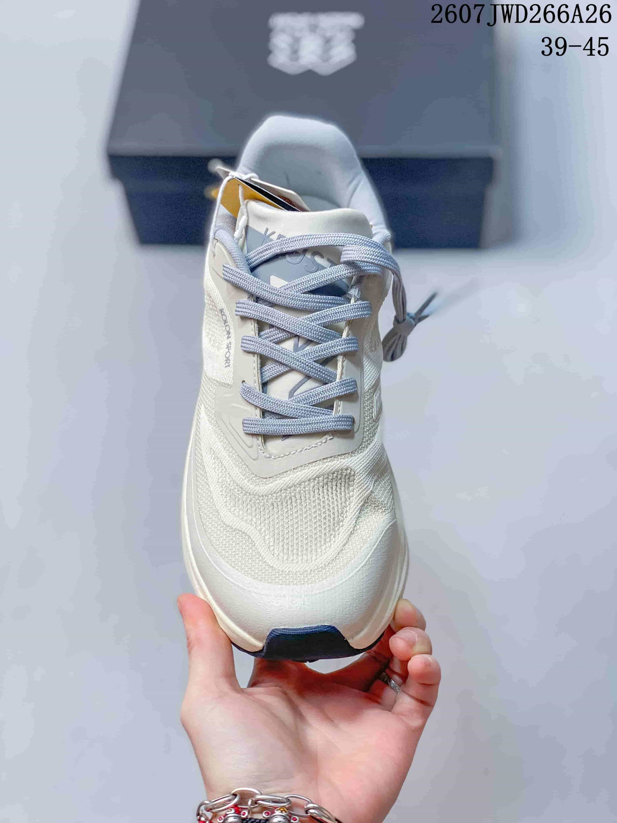 Front view of the off-white lace-up trail running shoe with a padded collar and navy toe outsole accent.