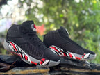 Pair of Jordan XXXVIII shoes showing the high-top shape and side graphics