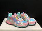 Angled front view highlighting the layered upper, lace-up fastening and multicolor sole design.