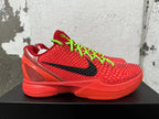 Side view of a red Nike basketball sneaker with black Swoosh and neon green laces
