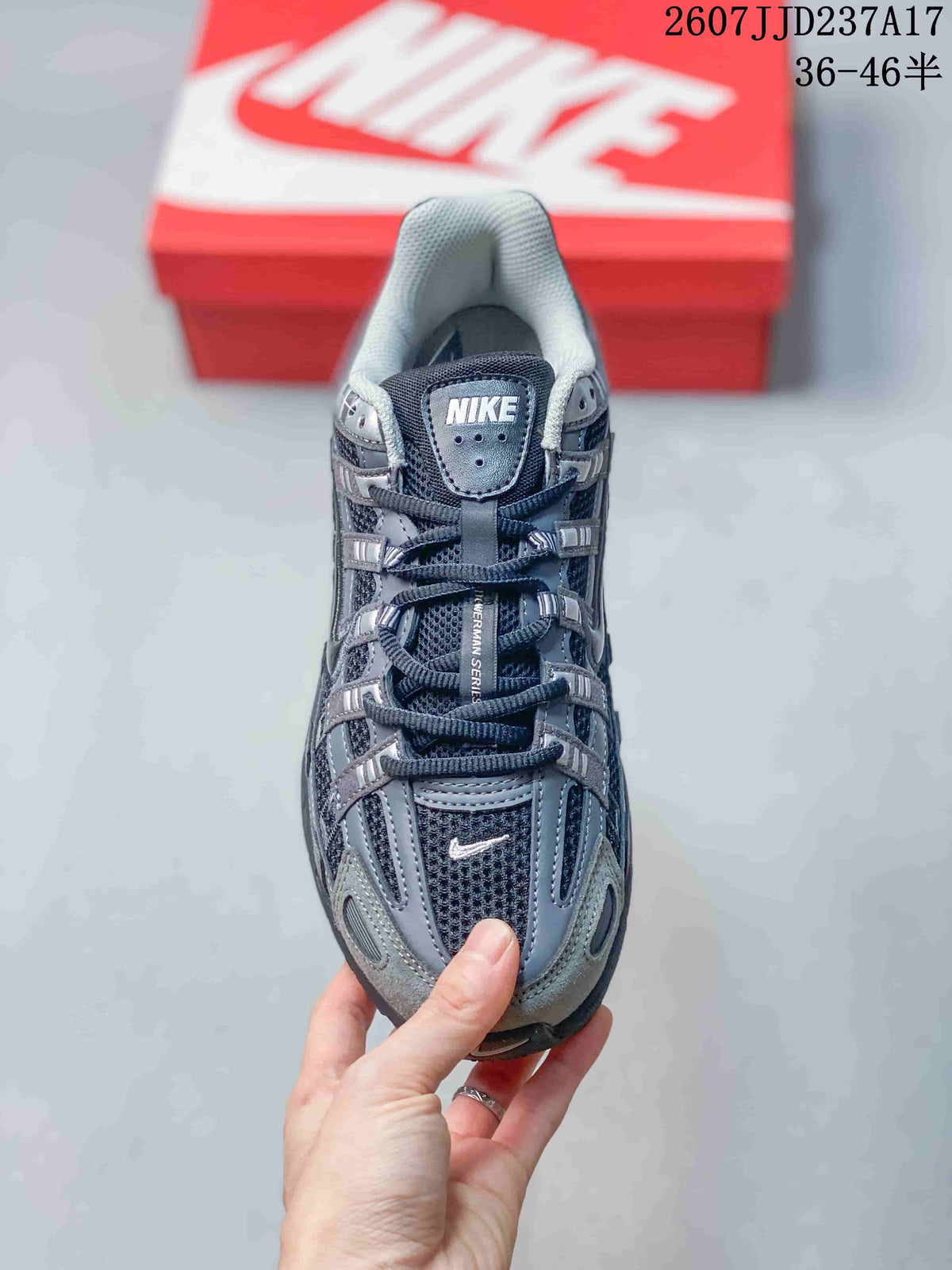Top view of the sneaker showing the mesh toe box, layered lace panels, padded tongue, and Nike branding.