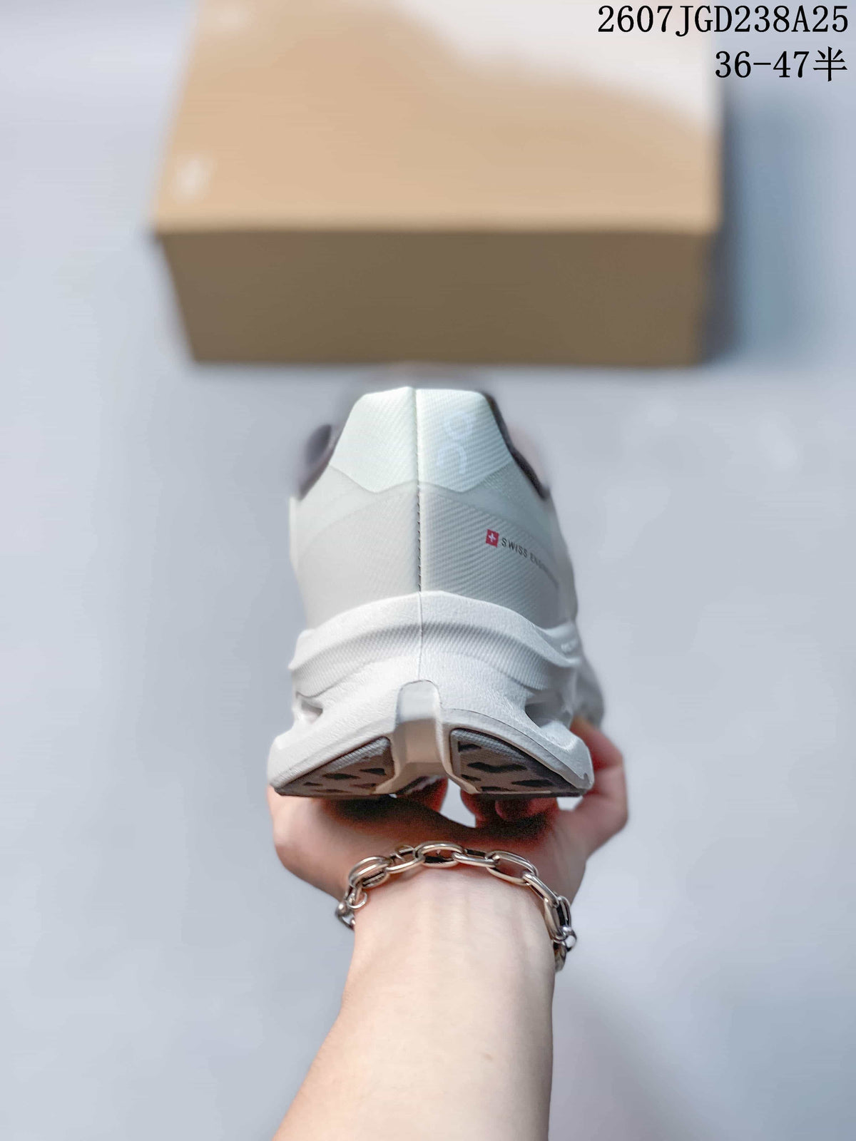 Rear view of the white and gray sneaker showing the heel structure and outsole.