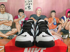 Front view of black-and-white Nike high-top sneakers with black laces and contrasting toe panels.