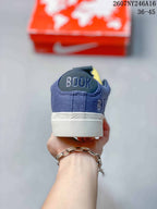 Rear view of the blue sneaker showing Booker branding on the heel and a white midsole.