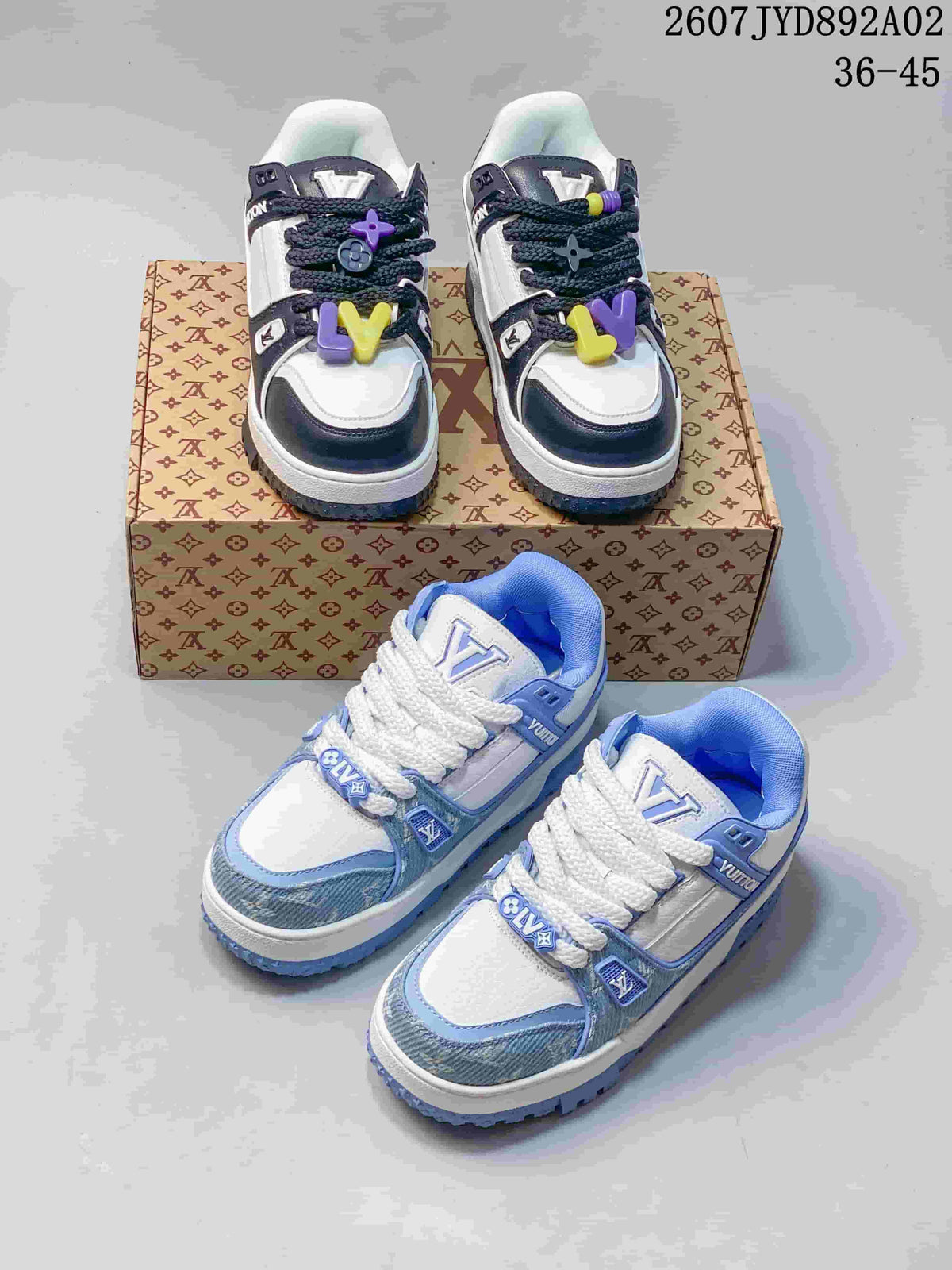 Two colorways of low-top sneakers displayed together: navy and white, and light blue and white