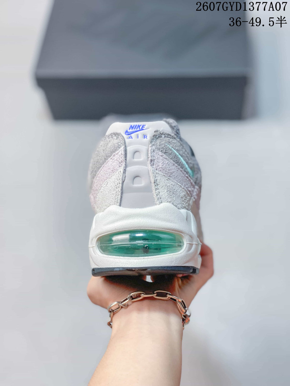 Rear view of a Nike Air Max 95 sneaker showing the translucent green heel Air window.