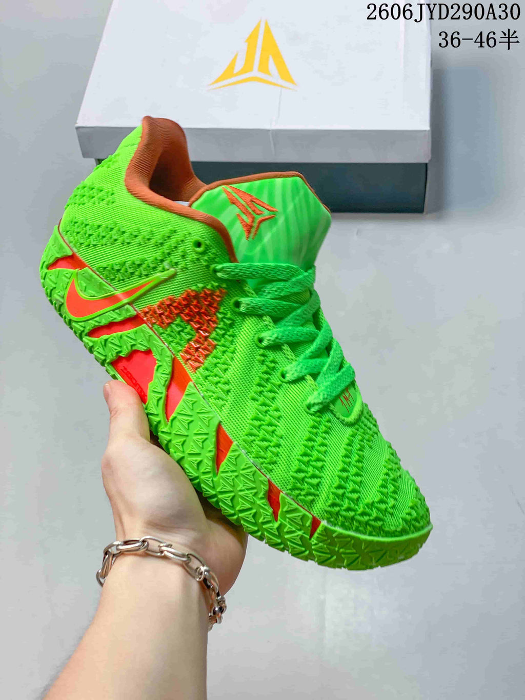 Bright green Nike Ja 3 basketball shoe with orange accents