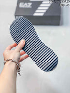 Close-up of the sneaker outsole showing a dark ridged traction pattern.