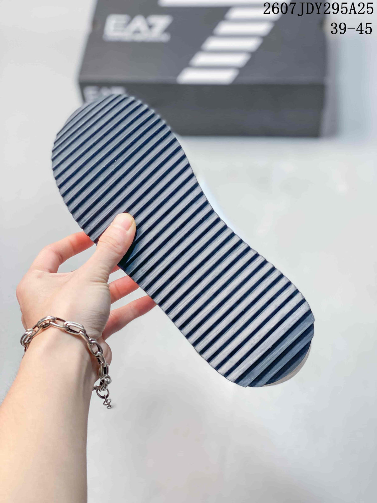 Close-up of the sneaker outsole showing a dark ridged traction pattern.