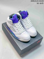 Pair of white and purple Jordan Air Jordan 5 high-top sneakers displayed on a box