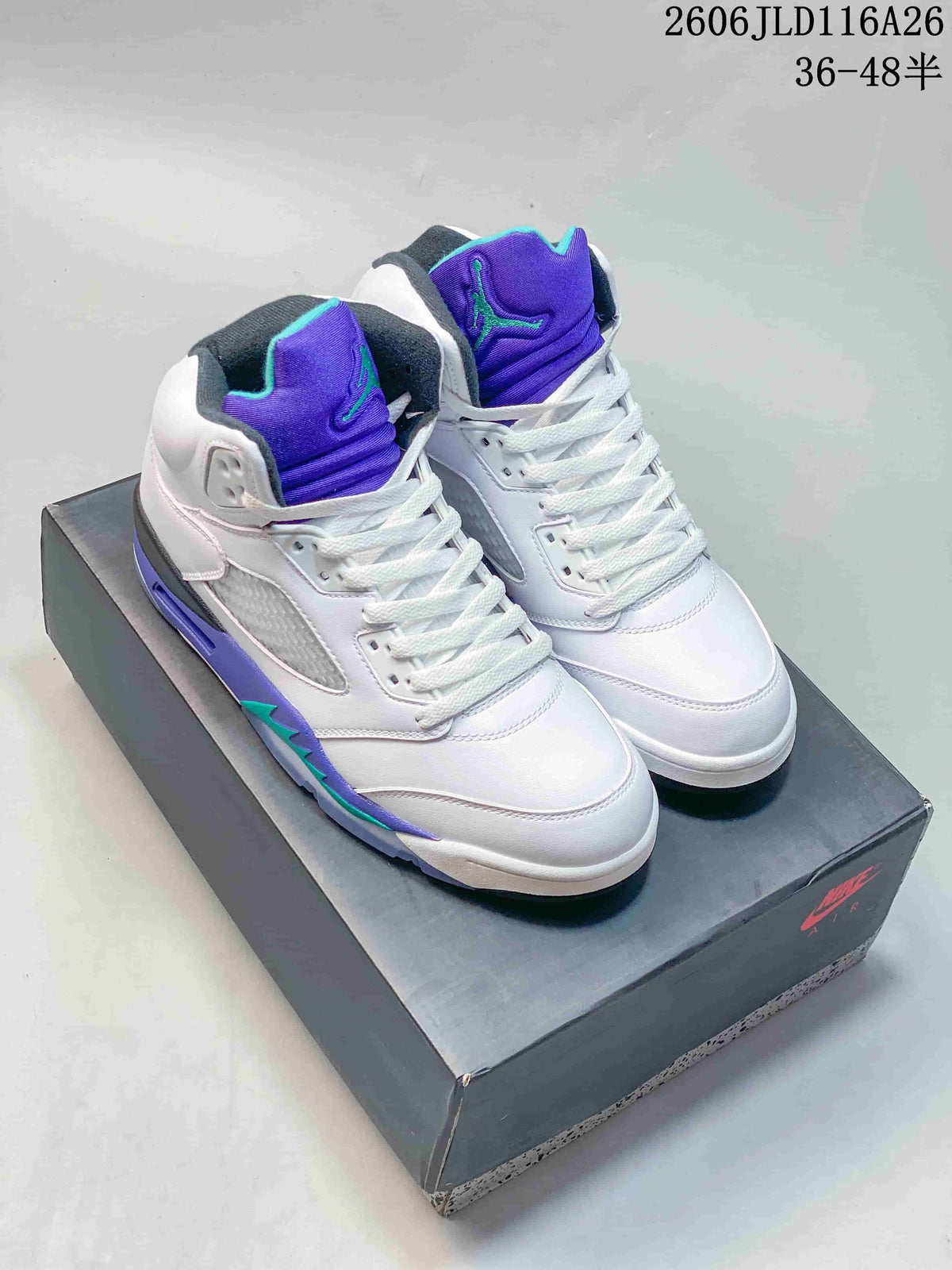 Pair of white and purple Jordan Air Jordan 5 high-top sneakers displayed on a box