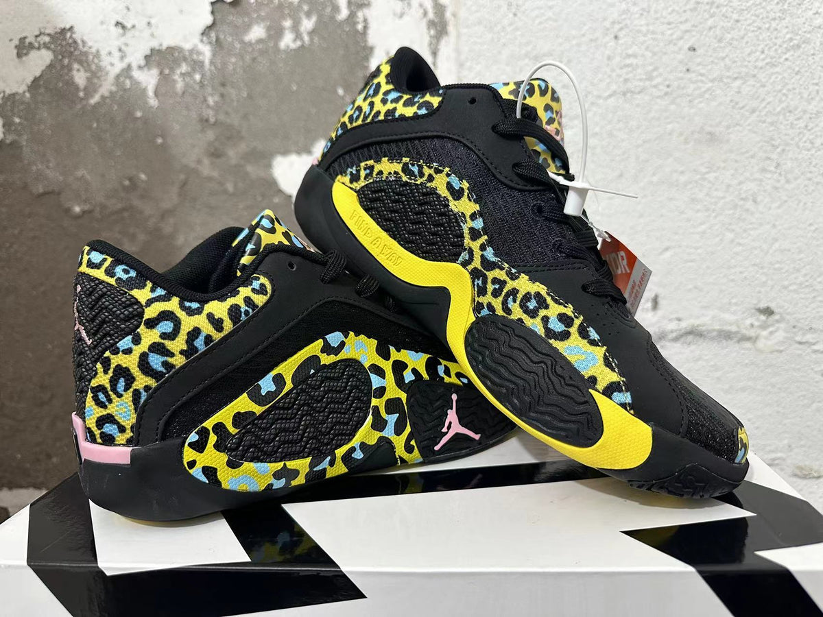 Two Jordan Luka 1 shoes displayed at an angle, showing the patterned uppers and outsole