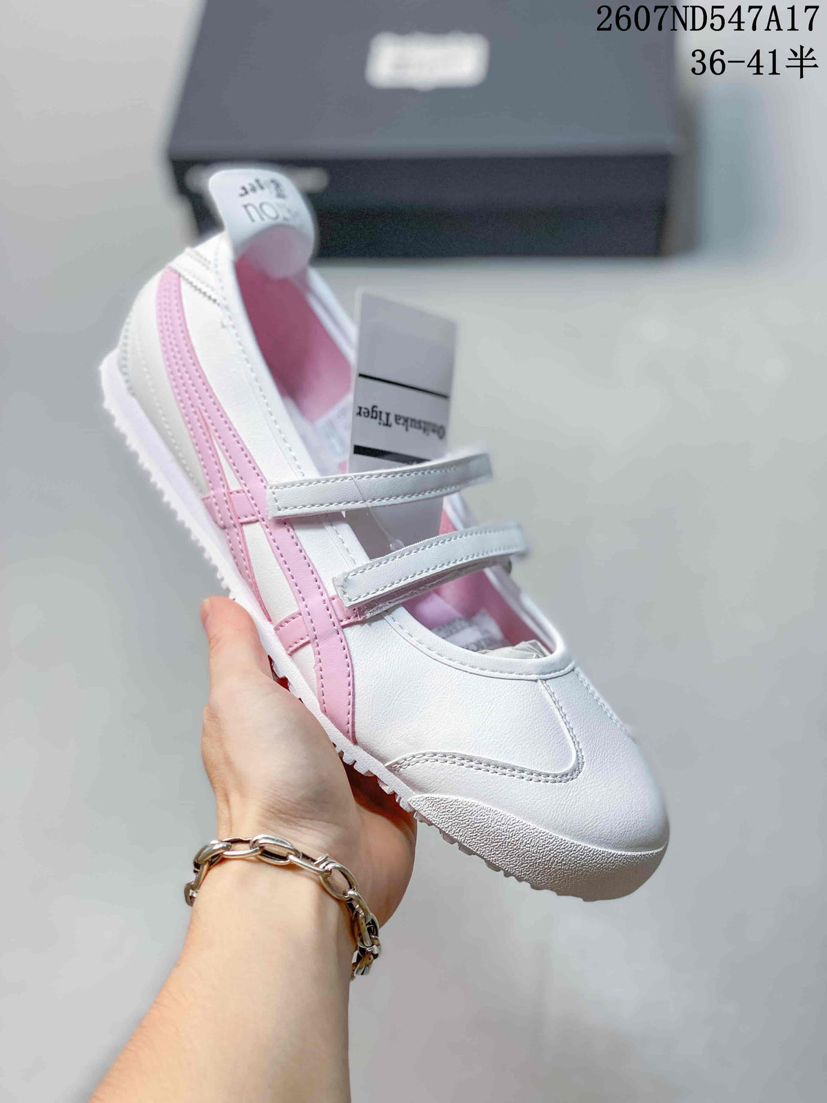 White Mary Jane sneaker with pink side stripes, pink interior lining and two adjustable straps.