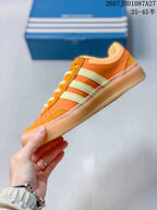 Side profile showing the low-top silhouette, three stripes and gum-colored sole.