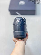 Rear view of a black sneaker showing the Nike Air heel marking and padded collar.