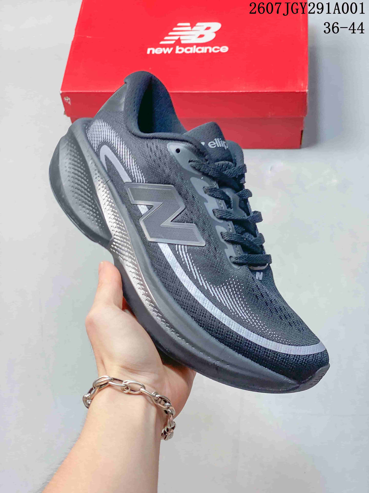 Dark gray New Balance running shoe with silver detailing and a dark sole.