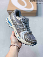 Angled side view of the silver-gray ASICS sneaker showing mesh panels, layered overlays, blue heel elements, and a cream midsole; image text shows style code 2607JHD294A24 and size range 36–46.5.