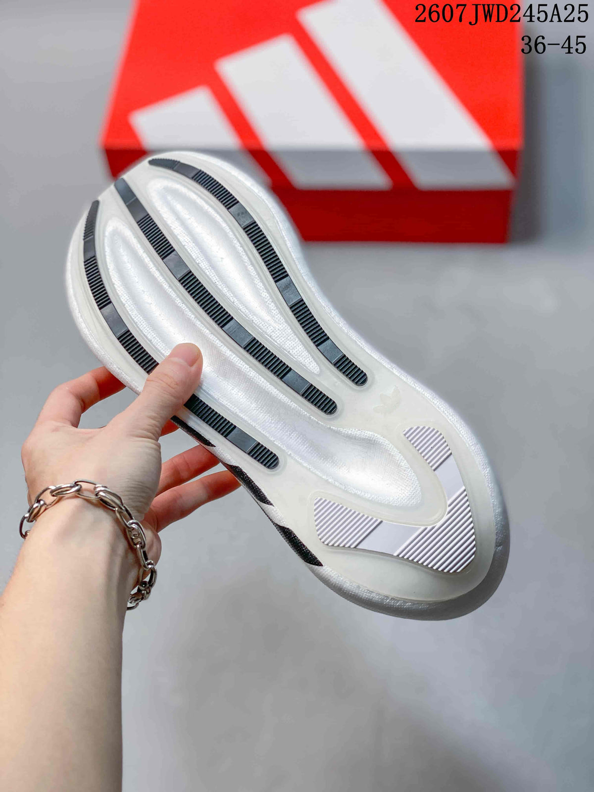 Close-up of the white sneaker outsole showing raised white sections and dark textured traction strips.