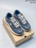 Pair of navy DESCENTE Chron low-top sneakers with cream laces displayed on a DESCENTE shoe box.