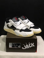 Pair of white and black Jordan Jumpman Jack TR sneakers displayed on a branded box; the box label shows sample size EU 43 and style code FZ8117 110.