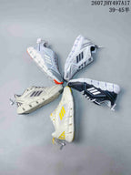 Overhead view of multiple Adidas Climacool Ventage colorways arranged together, including black, gray, white, and yellow designs.