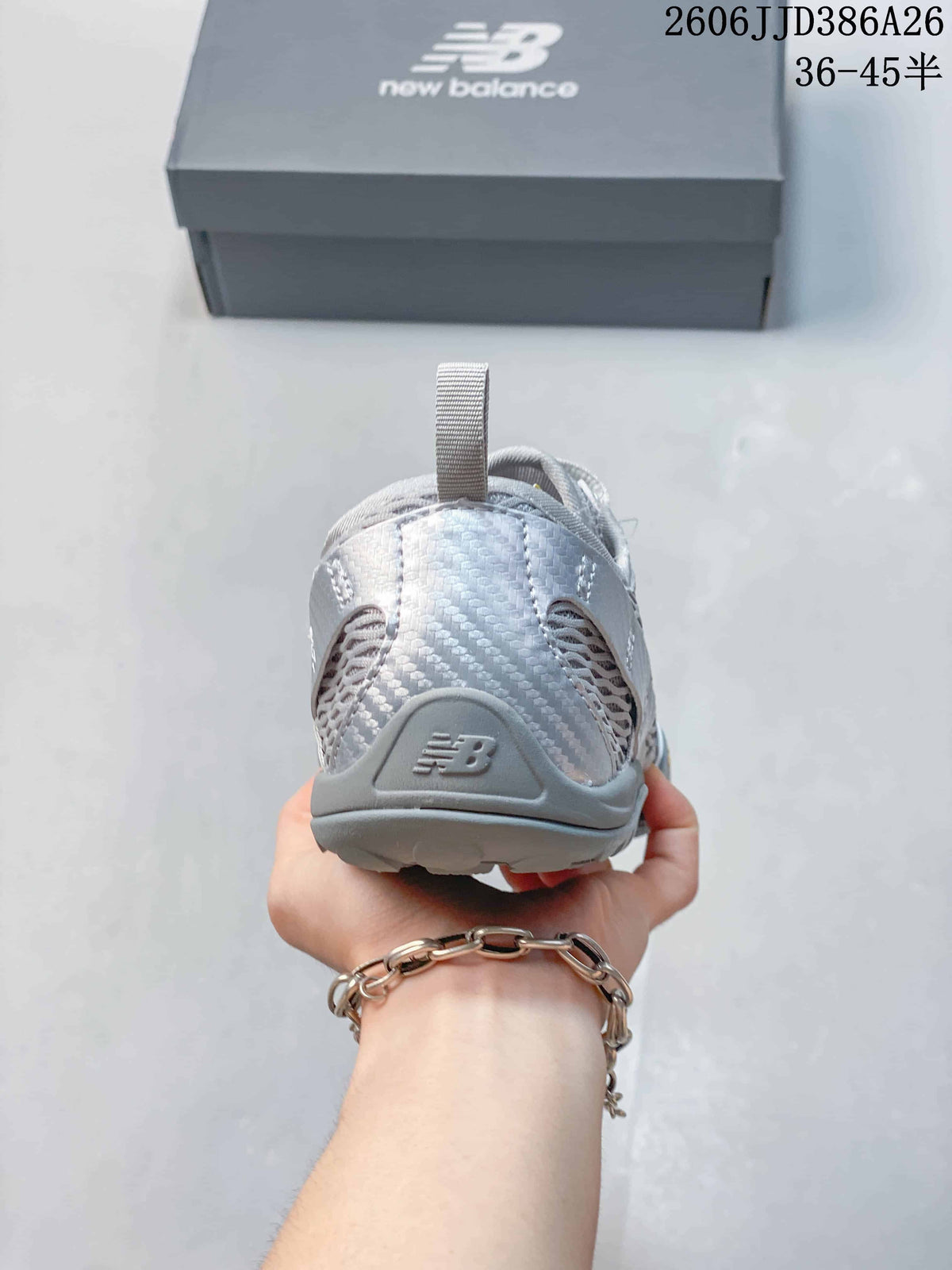 Rear view showing the heel structure, pull tabs, and New Balance branding.
