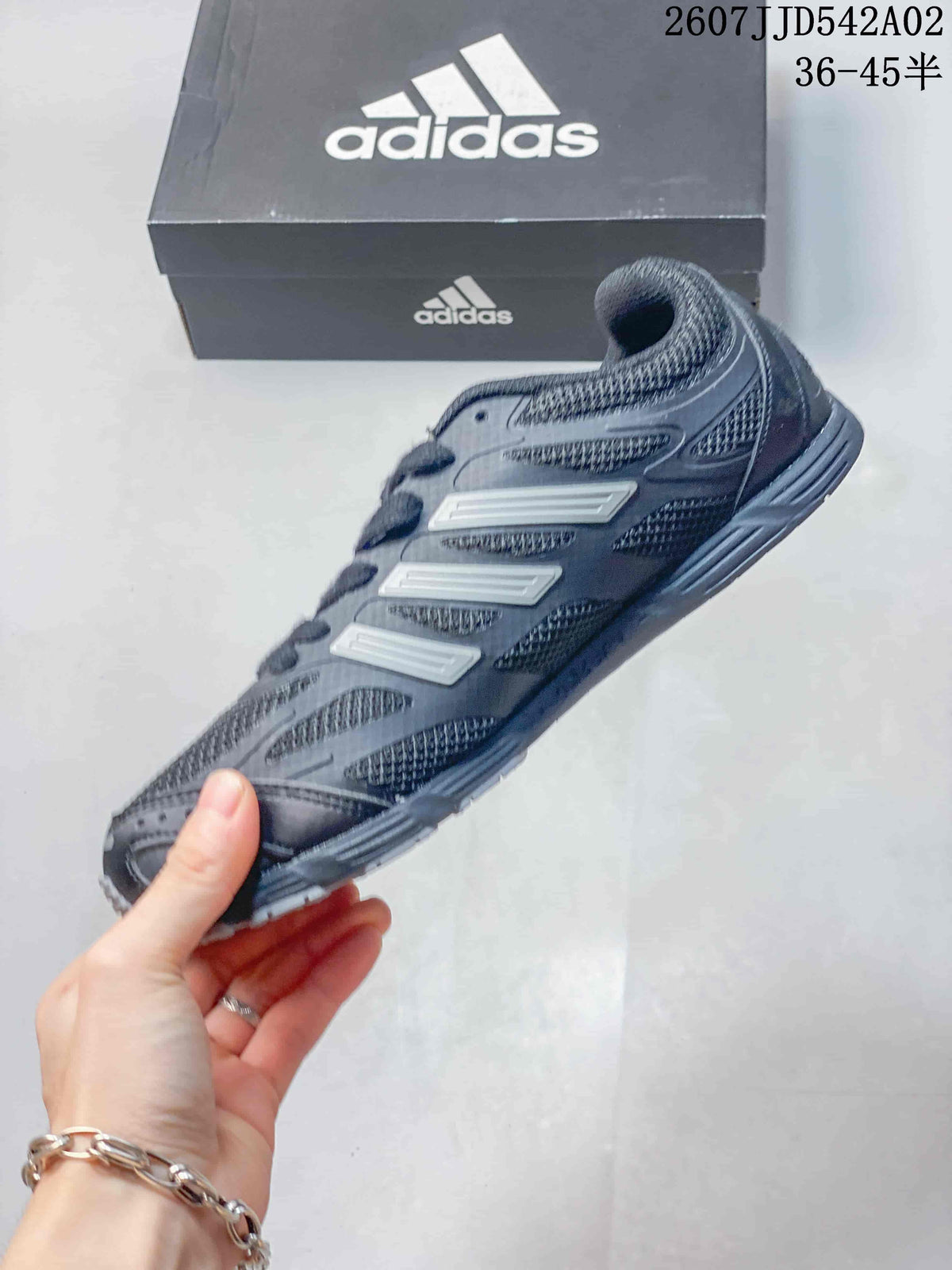Side view showing the mesh panels and three stripes on the sneaker