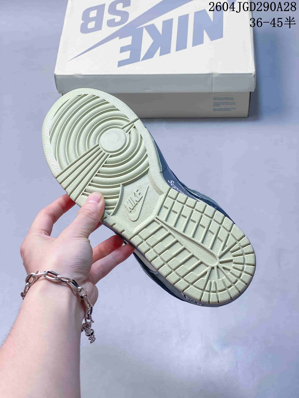 Close-up of the cream-colored outsole and tread of a low-top sneaker