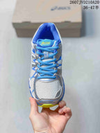 Top view of the sneaker showing the mesh-style toe box, blue laces and ASICS tongue logo.