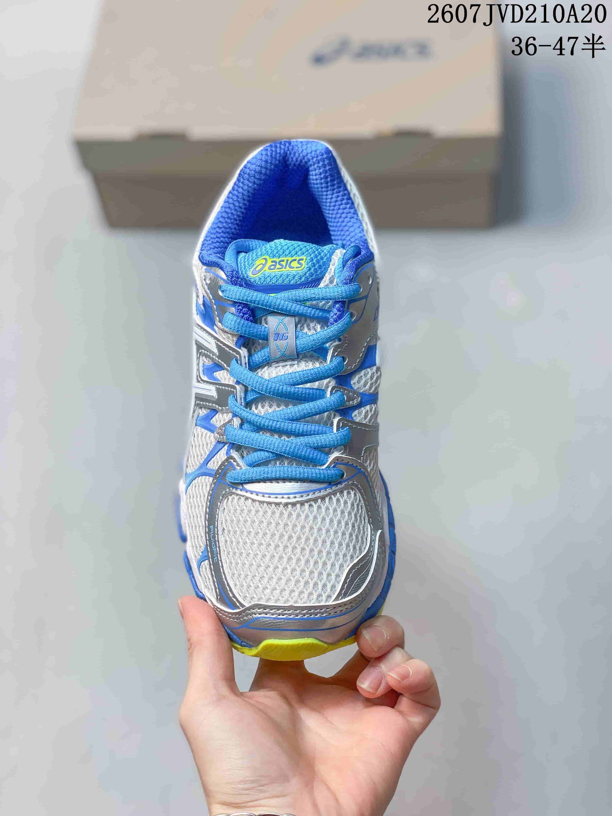 Top view of the sneaker showing the mesh-style toe box, blue laces and ASICS tongue logo.